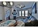Spacious living room with fireplace, large windows, and a comfortable seating area at 2757 Via Cipriani # 1132A, Clearwater, FL 33764