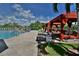 Inviting pool area with shaded cabanas and lounge chairs at 2757 Via Cipriani # 1132A, Clearwater, FL 33764
