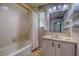 Bathroom with bathtub and tiled walls at 120 Palmetto Ln, Largo, FL 33770