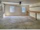 Spacious garage with built-in shelving and workbench at 120 Palmetto Ln, Largo, FL 33770