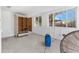 Bonus room with white wainscoting and several windows being dried out by industrial fans at 4519 Venetian Ne Blvd, St Petersburg, FL 33703