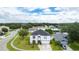 Two-story house with a gray roof, white exterior, and a landscaped yard at 2746 Heathgate Way, Land O Lakes, FL 34638