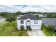 Two-story house with a gray roof, white exterior, and a landscaped yard at 2746 Heathgate Way, Land O Lakes, FL 34638