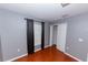 Bedroom with wood floors, window with blinds and closet at 2746 Heathgate Way, Land O Lakes, FL 34638