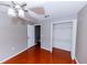 Bright bedroom with wood floors and ample closet space at 2746 Heathgate Way, Land O Lakes, FL 34638