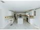Modern kitchen with white cabinets, marble countertops, and an island at 2746 Heathgate Way, Land O Lakes, FL 34638
