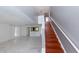 Staircase with wooden steps and gray walls at 2746 Heathgate Way, Land O Lakes, FL 34638