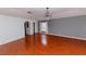 Spacious bedroom with wood floors and chandelier at 2746 Heathgate Way, Land O Lakes, FL 34638