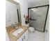Bathroom with granite countertop, white sink and walk-in shower at 2746 Heathgate Way, Land O Lakes, FL 34638