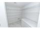 White pantry with wire shelving and a white chest freezer at 2746 Heathgate Way, Land O Lakes, FL 34638