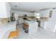 Modern kitchen with white cabinets, marble countertops, and an island at 2746 Heathgate Way, Land O Lakes, FL 34638