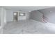 Bright and airy living room with marble floors and a view of the kitchen at 2746 Heathgate Way, Land O Lakes, FL 34638