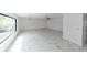 Large living room with marble floors and plenty of natural light at 2746 Heathgate Way, Land O Lakes, FL 34638