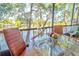 Bright dining area with water views and screened balcony at 9205 Tudor Dr # C209, Tampa, FL 33615