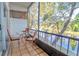Screened-in patio overlooking a canal, furnished with a small table and chairs at 9205 Tudor Dr # C209, Tampa, FL 33615