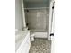 Clean bathroom with a bathtub, toilet and sink at 9205 Tudor Dr # C209, Tampa, FL 33615