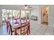 Dining room with table and chairs near a screened balcony at 9205 Tudor Dr # C209, Tampa, FL 33615