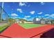 Community tennis court with red and green surface at 9205 Tudor Dr # C209, Tampa, FL 33615
