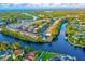 Aerial view of waterfront property with lush landscaping and boat access at 9205 Tudor Dr # C209, Tampa, FL 33615
