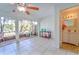Living room with access to a screened balcony and a half bathroom at 9205 Tudor Dr # C209, Tampa, FL 33615