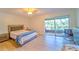 Bright bedroom with access to a private balcony at 9205 Tudor Dr # C209, Tampa, FL 33615