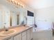 Bathroom boasts double vanity, corner tub, and a separate shower at 11111 Dormie Dr, San Antonio, FL 33576