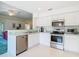 Bright kitchen features stainless steel appliances and ample cabinetry at 11111 Dormie Dr, San Antonio, FL 33576