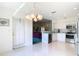 Kitchen features stainless steel appliances and a view to living room at 11111 Dormie Dr, San Antonio, FL 33576