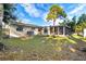 Spacious backyard with screened porch and mature tree at 1366 62 S Pl, St Petersburg, FL 33705