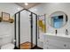 Clean bathroom with a walk-in shower and modern vanity at 963 Highland Ave, Dunedin, FL 34698