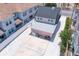 Aerial view of pink house with back parking area at 963 Highland Ave, Dunedin, FL 34698