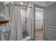 Clean bathroom with a walk-in shower and white tile at 963 Highland Ave, Dunedin, FL 34698