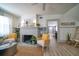 Spacious living area with a fireplace and views into adjacent rooms at 963 Highland Ave, Dunedin, FL 34698