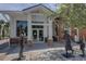Community building with bronze statues and welcoming entrance at 963 Highland Ave, Dunedin, FL 34698