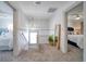 Upstairs hallway with carpet, a full-length mirror, and access to bedrooms at 963 Highland Ave, Dunedin, FL 34698
