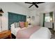 Cozy bedroom with a green headboard and soft textiles at 963 Highland Ave, Dunedin, FL 34698