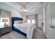 Spacious bedroom with a queen bed, neutral decor, and natural light at 963 Highland Ave, Dunedin, FL 34698