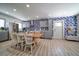 Modern kitchen with grey cabinets, stainless steel appliances, and tropical wallpaper at 963 Highland Ave, Dunedin, FL 34698