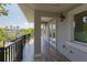 Balcony with views of the city featuring black metal railings, tile floors and French doors at 1408 W Azeele St, Tampa, FL 33606