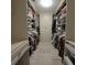 Walk-in closet with adjustable shelving, drawers and closet rod for optimal storage at 1408 W Azeele St, Tampa, FL 33606