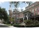 Historic brick building with ornate details, lush landscaping and a well-maintained lawn at 1408 W Azeele St, Tampa, FL 33606