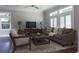 An inviting living room featuring an area rug, a comfortable sofa, chair, and natural light at 1408 W Azeele St, Tampa, FL 33606