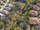 Aerial view of a neighborhood with a creek and wooden footbridge at 7219 Hamilton Rd # 7219, Bradenton, FL 34209