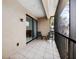Private screened balcony with tile flooring and outdoor seating at 7219 Hamilton Rd # 7219, Bradenton, FL 34209