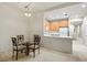 Small dining area with glass-top table and four chairs at 7219 Hamilton Rd # 7219, Bradenton, FL 34209