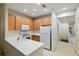Modern kitchen with light wood cabinets and white appliances at 7219 Hamilton Rd # 7219, Bradenton, FL 34209