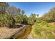 Tranquil waterway with lush landscaping at 7219 Hamilton Rd # 7219, Bradenton, FL 34209