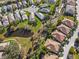 Aerial view of neighborhood with pond and creek at 7219 Hamilton Rd # 7219, Bradenton, FL 34209