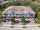 Aerial view of townhouses with attached garages and lush landscaping at 7219 Hamilton Rd # 7219, Bradenton, FL 34209