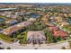 Aerial view of a community with houses, landscaping, and a pond at 7219 Hamilton Rd # 7219, Bradenton, FL 34209